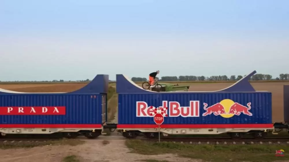 The Weekend Leader - Red Bull Stunt: Dawid Godziek Performs World’s First Bike Flip on Moving Train